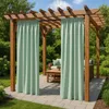 Outdoor pergola with light green curtains and patio furniture. Podgląd zdjęcia produktu