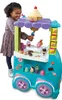 A young girl is playing with a Play-Doh ice cream cart. Náhľad obrázku produktu
