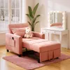 A pink convertible sofa bed is shown in a room with a vanity and a large window. Anteprima dell’immagine prodotto