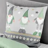 A close-up of a pillow with a gnome and star pattern. Produktbild-Vorschau