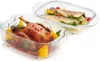 Two glass baking dishes, one with a roasted duck and the other with baked fish, are presented on a white background. Voir les images du produit