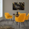A dining set with four mustard yellow chairs around a round wooden table, with a piece of abstract art on the wall. Náhľad obrázku produktu