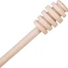 A wooden honey dipper on a white background. Náhľad obrázku produktu