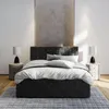 A bedroom scene featuring a bed, nightstands, and lamps. Produktbild-Vorschau