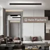 A modern living room with a sleek LED ceiling light, shown in a phone screen reflection. Náhľad obrázku produktu