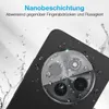 A close-up of a smartphone camera lens with water droplets on it, suggesting water resistance. Produktbild-Vorschau