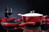 A still life arrangement featuring cookware, a bottle of wine, and a wine glass. Náhled obrázku produktu