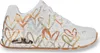 A white sneaker with a metallic heart pattern. Anteprima dell’immagine prodotto