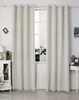 A pair of cream-colored curtains hangs in front of a window, with a white cabinet to the left and a small table to the right. Produktbild-Vorschau