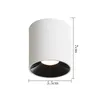 A white cylindrical LED ceiling light with a black interior, shown against a white background with size indicators. Produktbild-Vorschau