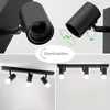 A collage of images showing a black track light fixture with adjustable spotlights, demonstrating its rotation capabilities and different mounting options. Náhľad obrázku produktu