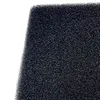 A close-up view of a black foam filter material. Produktbild-Vorschau