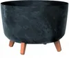 A dark gray planter with a marbled effect sits on three brown legs against a white background. Anteprima dell’immagine prodotto