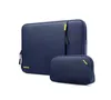 A navy blue laptop sleeve and a matching accessory pouch are displayed against a white background. Produktbild-Vorschau