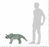 A plush toy Triceratops is shown next to a silhouette of a person for scale. Produktbild-Vorschau