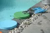 Poolside accessories including cushions, goggles, and flippers. Produktbild-Vorschau