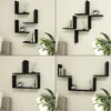 A collage of four images showing different arrangements of black L-shaped wall shelves with decorative items and books. Podgląd zdjęcia produktu