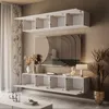 A modern living room with a wall-mounted entertainment unit and a large abstract painting. Produktbild-Vorschau