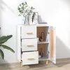 A white sideboard with three drawers and a cabinet is shown in a room with a plant and artwork. Produktbild-Vorschau