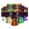 A collection of coffee capsule boxes and individual coffee capsules arranged in a display. Voir les images du produit