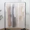A transparent garment bag covering clothes hanging on a rack. Produktbild-Vorschau