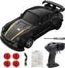 A black remote control drift car with yellow racing stripes and accessories. Produktbild-Vorschau