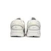 A back view of a pair of white Nike Huarache sneakers against a white background. Podgląd zdjęcia produktu