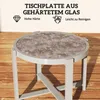 A round side table with a textured glass top, shown on a wooden deck. Produktbild-Vorschau