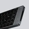 A close-up, angled view of a dark gray mechanical keyboard with black keys against a light gray background. Anteprima dell’immagine prodotto