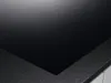 A close-up view of a black glass ceramic hob with a textured gray border. Anteprima dell’immagine prodotto