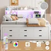 A white bed with storage drawers and a headboard with LED lighting, set in a bedroom. Produktbild-Vorschau
