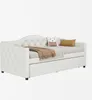 A white daybed with a pull-out trundle, decorated with pillows and a blanket. Produktbild-Vorschau