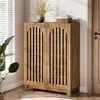 A wooden shoe cabinet with slatted doors is shown in a room with blinds and a plant. Anteprima dell’immagine prodotto