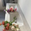 Two bouquets of flowers are placed on a light-colored sink. Anteprima dell’immagine prodotto