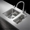 A modern stainless steel kitchen sink with a faucet and soap dispenser. Produktbild-Vorschau