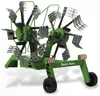 A green agricultural implement with rotating tines, designed for raking hay. Produktbild-Vorschau