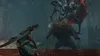 A character in a green outfit fights two monsters in a dark, jungle-like environment with red water. Produktbild-Vorschau