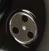 A close-up view of a ventilation component on a black grill. Produktbild-Vorschau