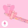 A pink gel pen with a butterfly design and the text 'YOU ARE BEAUTIFUL' is shown against a pink background. A larger, stylized pink butterfly graphic is in the background. Podgląd zdjęcia produktu