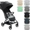 A black stroller is shown next to several colored inserts for the stroller seat. Produktbild-Vorschau
