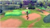 A scene from a video game with characters walking on a path near a lake and a house. Produktbild-Vorschau