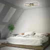 A bedroom with a bed and a ceiling lamp. Produktbild-Vorschau