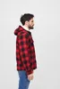 A man wearing a red and black plaid hooded jacket and blue jeans, shown from the side against a white background. Náhled obrázku produktu
