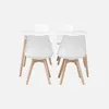 A white rectangular dining table with four white chairs with wooden legs, set against a white background. Anteprima dell’immagine prodotto
