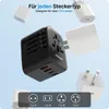 A black universal travel adapter is shown with various plug types and USB ports, surrounded by different country plug adapters. Produktbild-Vorschau