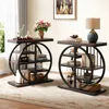 Two industrial-style side tables with circular shelving units are displayed in a living room setting. Anteprima dell’immagine prodotto