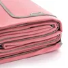 A folded pink picnic blanket with gray trim, shown on a white background. Podgląd zdjęcia produktu