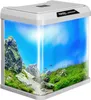 A Kruger Meier Como Aquarium 16l with a white frame, showcasing a vibrant underwater scene with rocks, green plants, and small red fish. Podgląd zdjęcia produktu