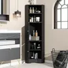 A black corner cabinet filled with various bathroom products, placed next to a vanity and a laundry basket, with a window in the background. Voir les images du produit