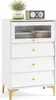 A white chest of drawers with a fluted glass door and gold legs, decorated with a plant and a radio on top. Podgląd zdjęcia produktu